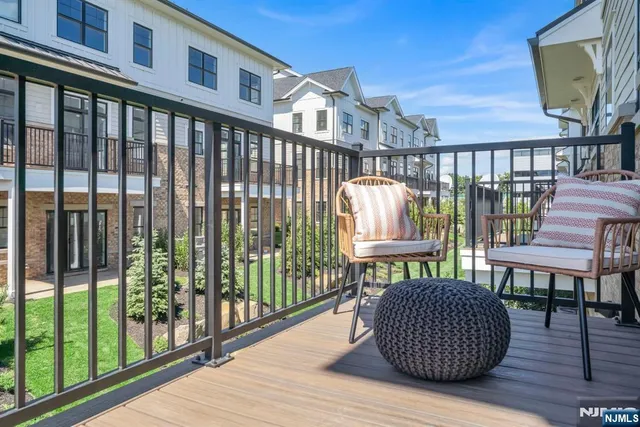 a spacious bedroom with a large bed and a large window