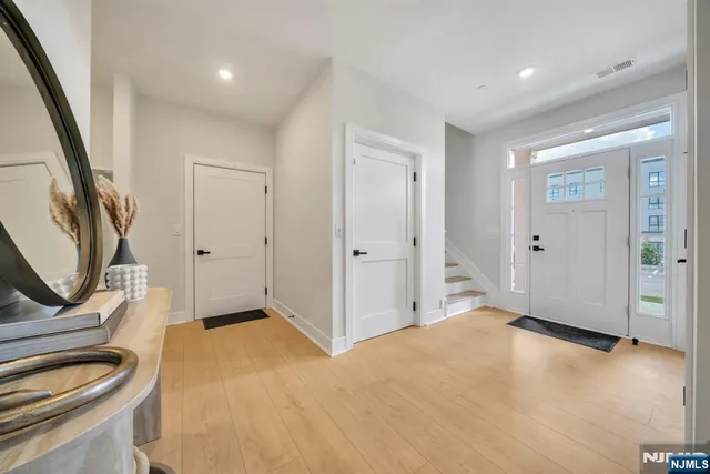 a bedroom with a sink and a mirror