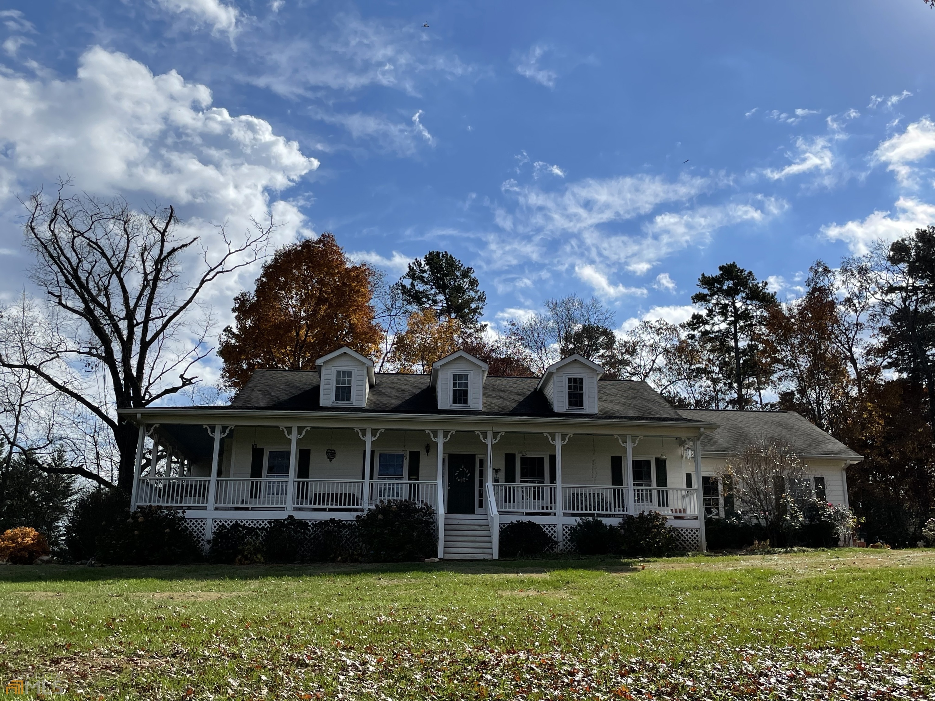 110 Asa Dorsey Road Cleveland, GA 30528 - Photo 1 of 1 a front view of a house with a garden
