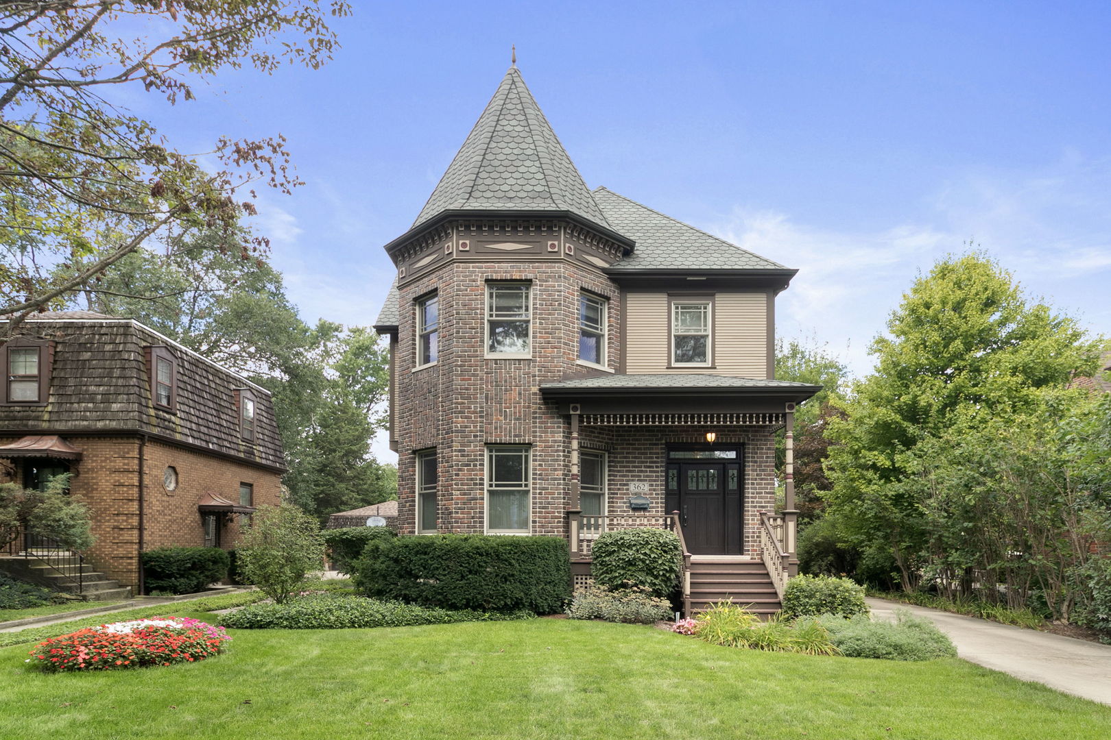 362 Downing Road Riverside, IL 60546 - Photo 1 of 40 a front view of a house with garden