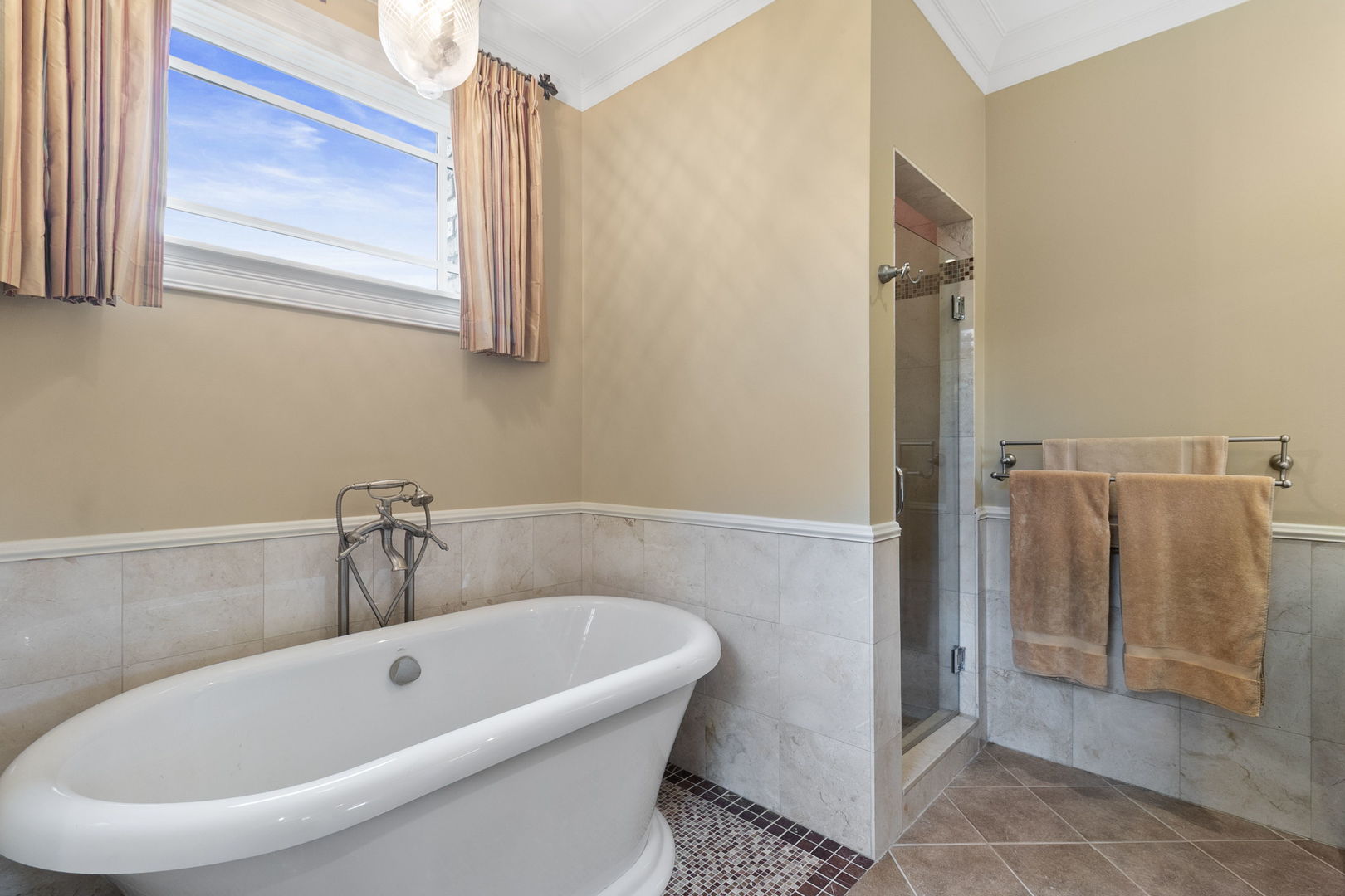362 Downing Road Riverside, IL 60546 - Photo 19 of 40 a bathroom with a tub and shower