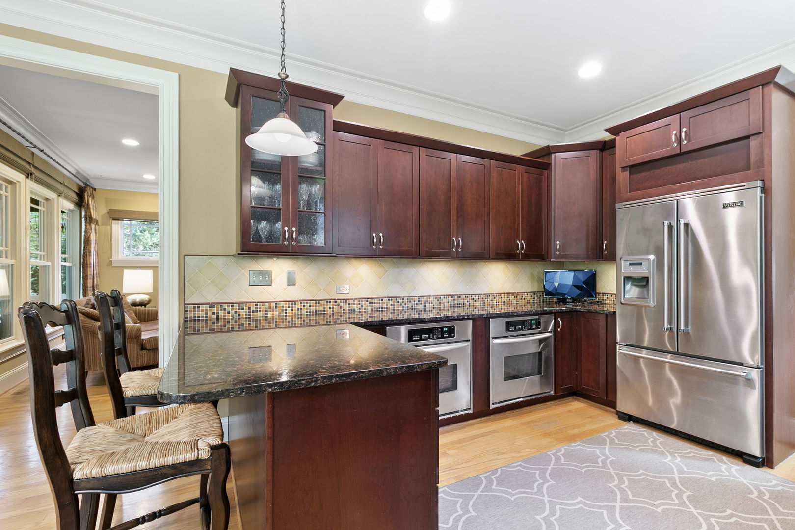 362 Downing Road Riverside, IL 60546 - Photo 6 of 40 a kitchen with stainless steel appliances granite countertop a refrigerator a stove top oven a sink and dishwasher