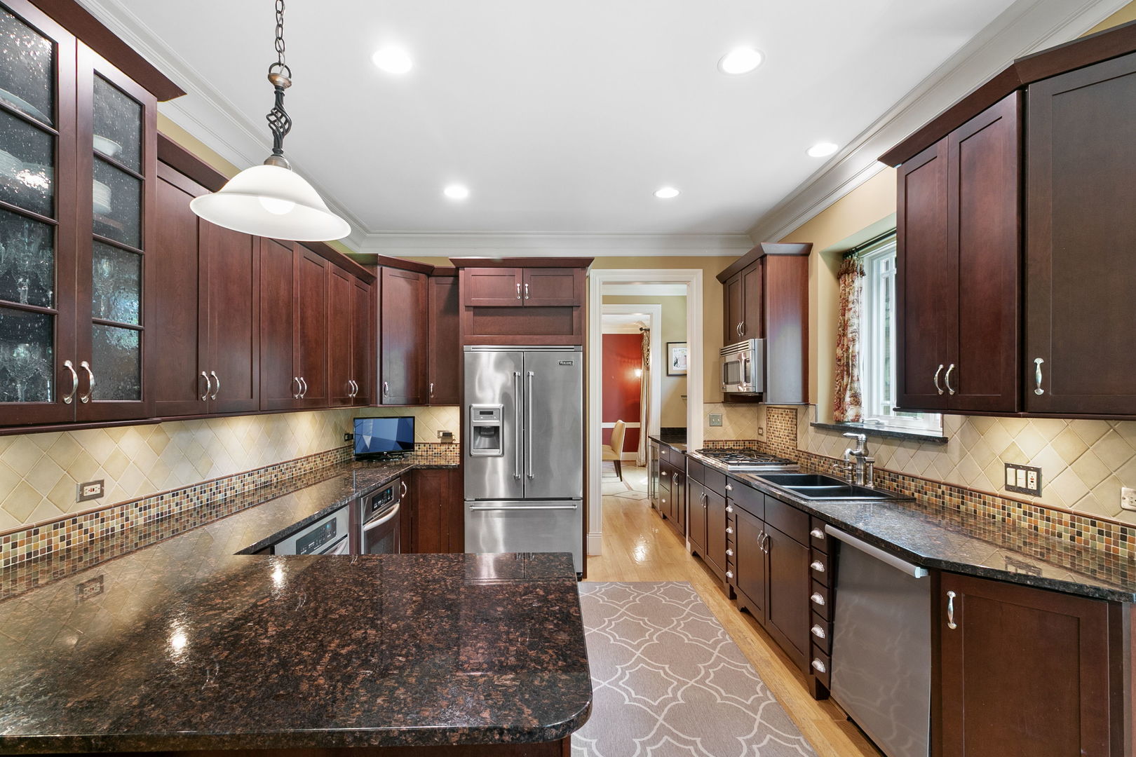 362 Downing Road Riverside, IL 60546 - Photo 7 of 40 a kitchen with stainless steel appliances granite countertop a sink stove and refrigerator
