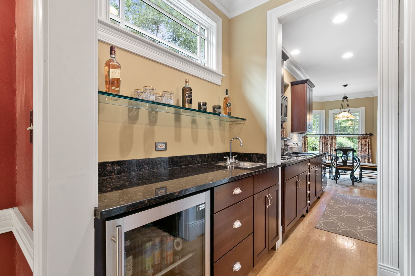362 Downing Road Riverside, IL 60546 - Photo 9 of 40 a kitchen with stainless steel appliances granite countertop a stove a sink and a microwave