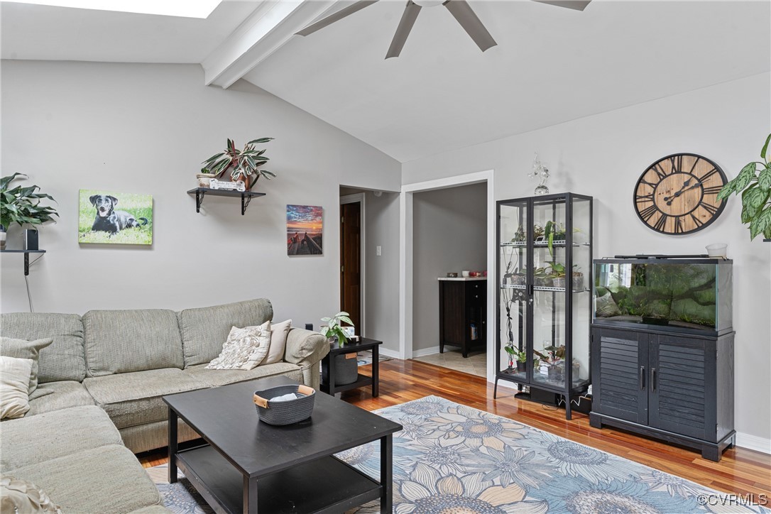 4405 Rabbit Foot Place Chesterfield, VA 23236 - Photo 21 of 38 a living room with furniture a floor to ceiling window and a flat screen tv