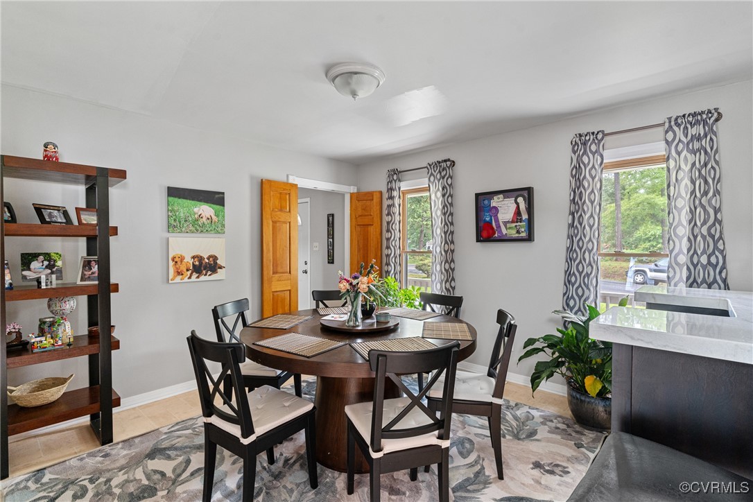 4405 Rabbit Foot Place Chesterfield, VA 23236 - Photo 22 of 38 a view of a livingroom and dining room with furniture window and outside view