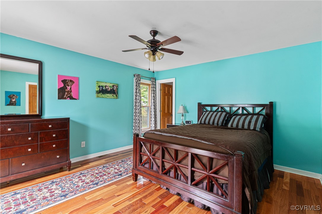 4405 Rabbit Foot Place Chesterfield, VA 23236 - Photo 30 of 38 a bedroom with a bed and a chandelier