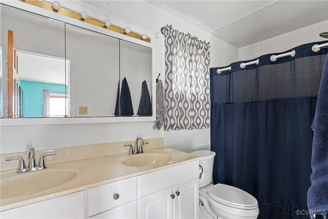4405 Rabbit Foot Place Chesterfield, VA 23236 - Photo 33 of 38 a bathroom with a sink and a mirror