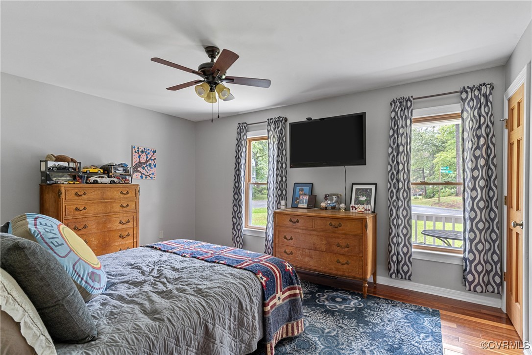 4405 Rabbit Foot Place Chesterfield, VA 23236 - Photo 34 of 38 a bedroom with a bed and a flat screen tv