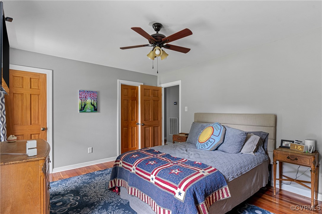 4405 Rabbit Foot Place Chesterfield, VA 23236 - Photo 35 of 38 a bedroom with a bed and a chandelier