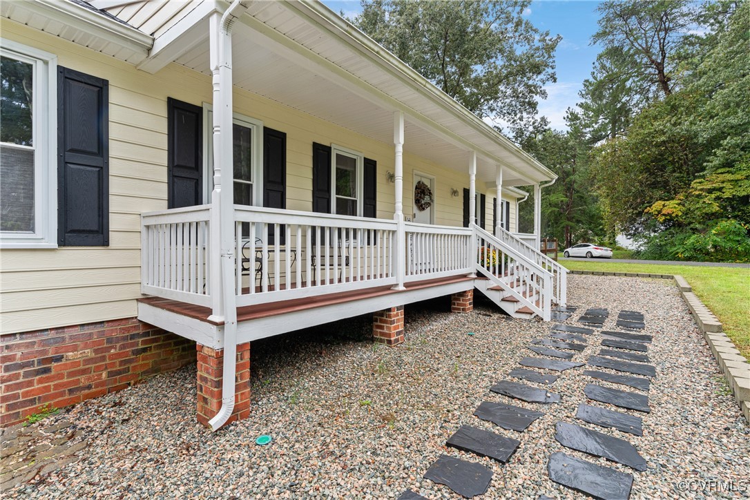 4405 Rabbit Foot Place Chesterfield, VA 23236 - Photo 5 of 38 a view of a house with wooden deck and a yard