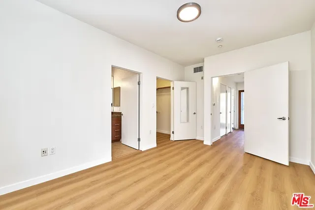 a view of a livingroom with wooden floor