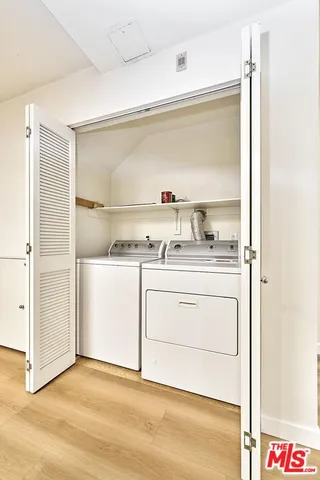 a utility room with washer and dryer