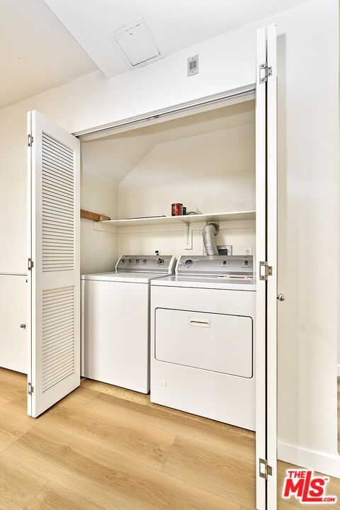 2864 Sunset Place, Unit 203 Los Angeles, CA 90005 - Photo 18 of 21 a utility room with washer and dryer