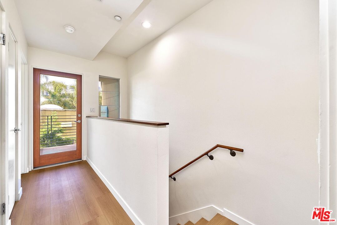 2864 Sunset Place, Unit 203 Los Angeles, CA 90005 - Photo 10 of 21 a view of a room with wooden floor and windows
