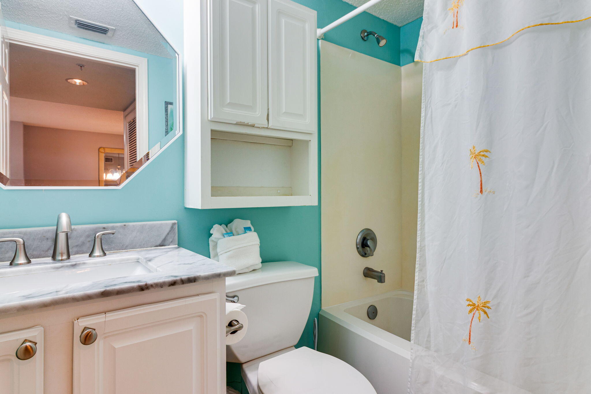 970 Highway 98, Unit 303 Destin, FL 32541 - Photo 36 of 42 a bathroom with a granite countertop sink toilet and shower