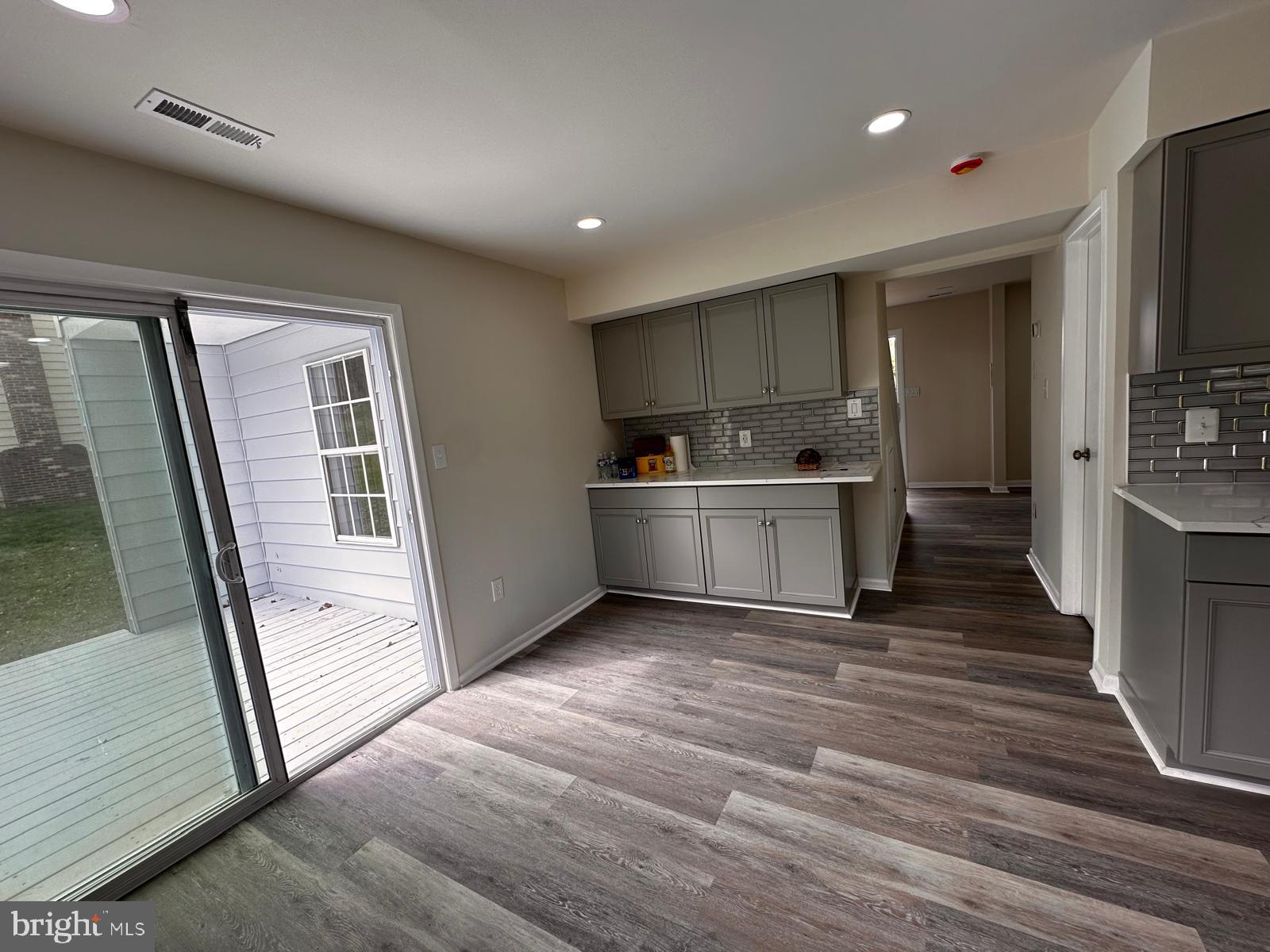 12800 Asbury Drive Fort Washington, MD 20744 - Photo 12 of 53 a view of a big room with wooden floor and windows