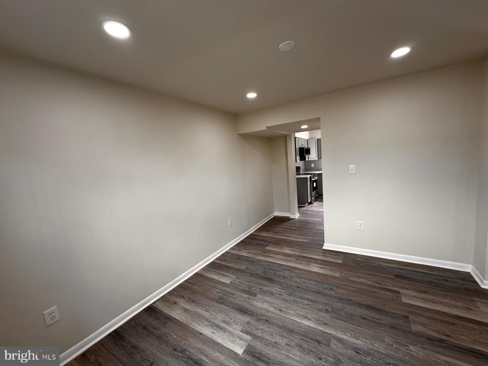 12800 Asbury Drive Fort Washington, MD 20744 - Photo 16 of 53 a view of empty room with wooden floor