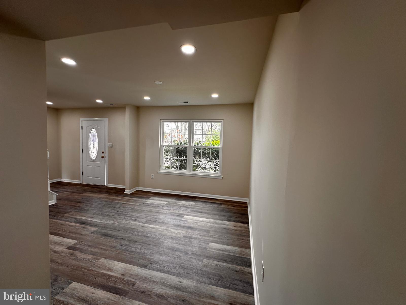 12800 Asbury Drive Fort Washington, MD 20744 - Photo 18 of 53 a view of an empty room with window and wooden floor