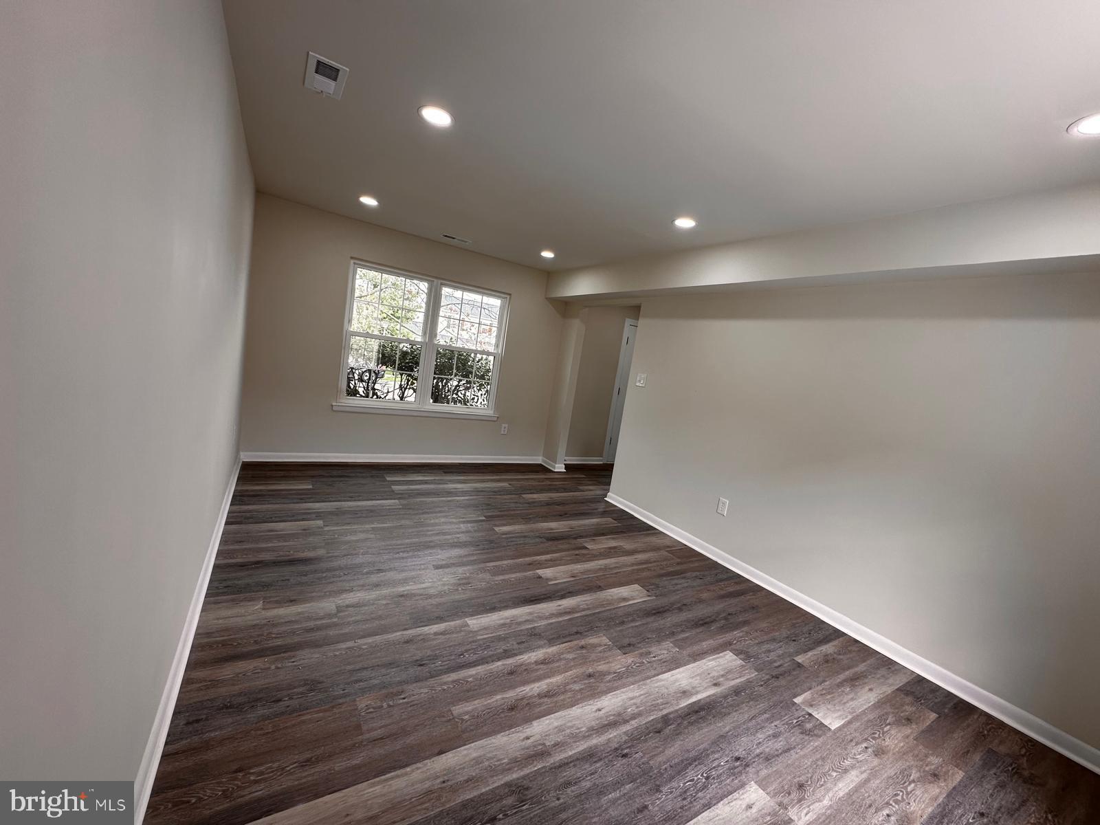 12800 Asbury Drive Fort Washington, MD 20744 - Photo 20 of 53 wooden floor in an empty room with a window