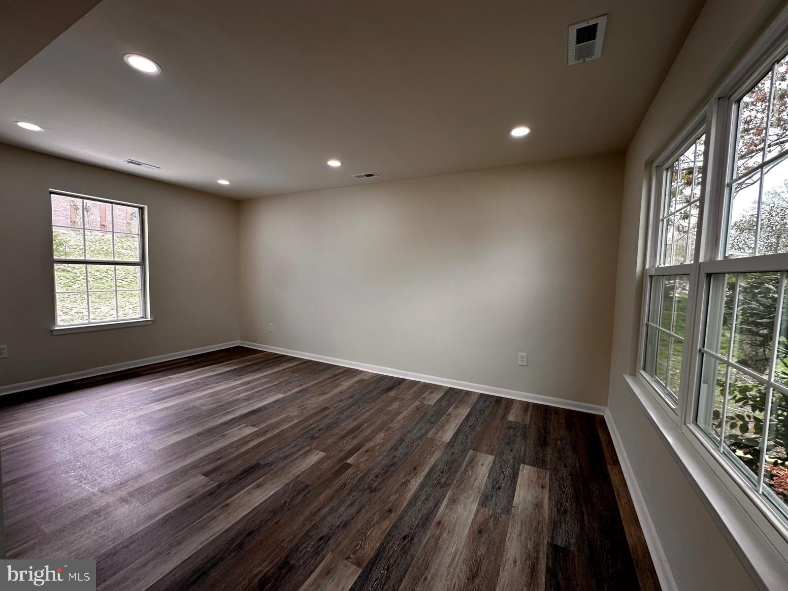 12800 Asbury Drive Fort Washington, MD 20744 - Photo 21 of 53 an empty room with wooden floor and windows
