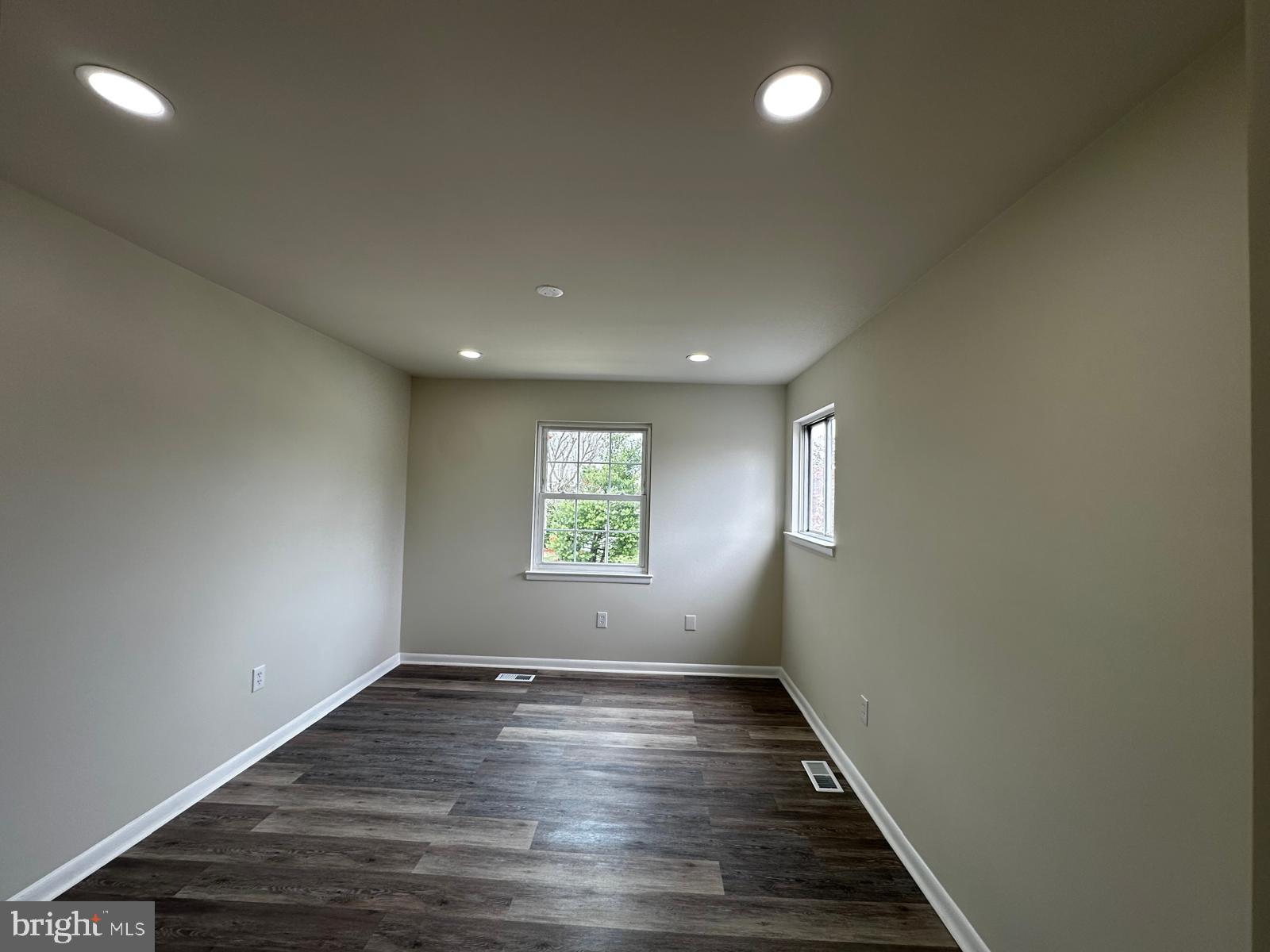 12800 Asbury Drive Fort Washington, MD 20744 - Photo 28 of 53 an empty room with wooden floor and windows