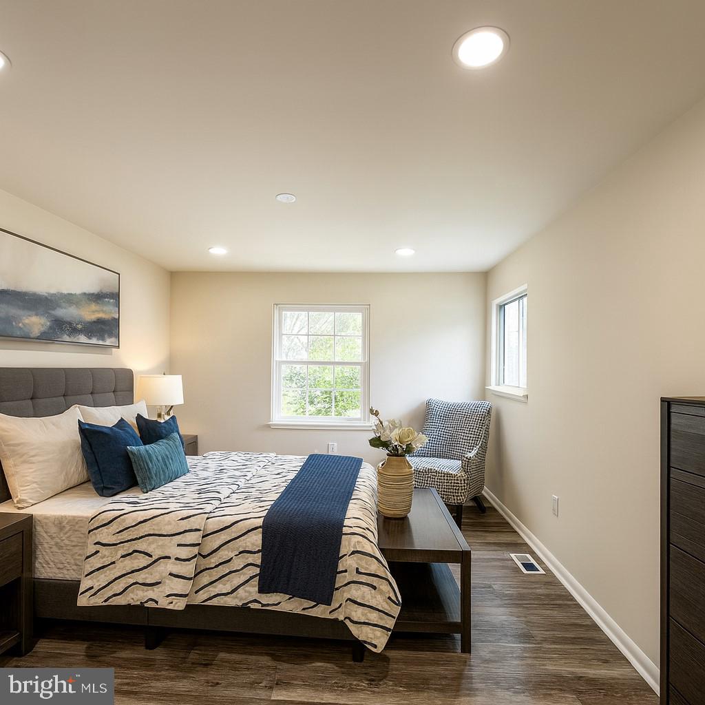 12800 Asbury Drive Fort Washington, MD 20744 - Photo 29 of 53 a bedroom with a bed and wooden floor