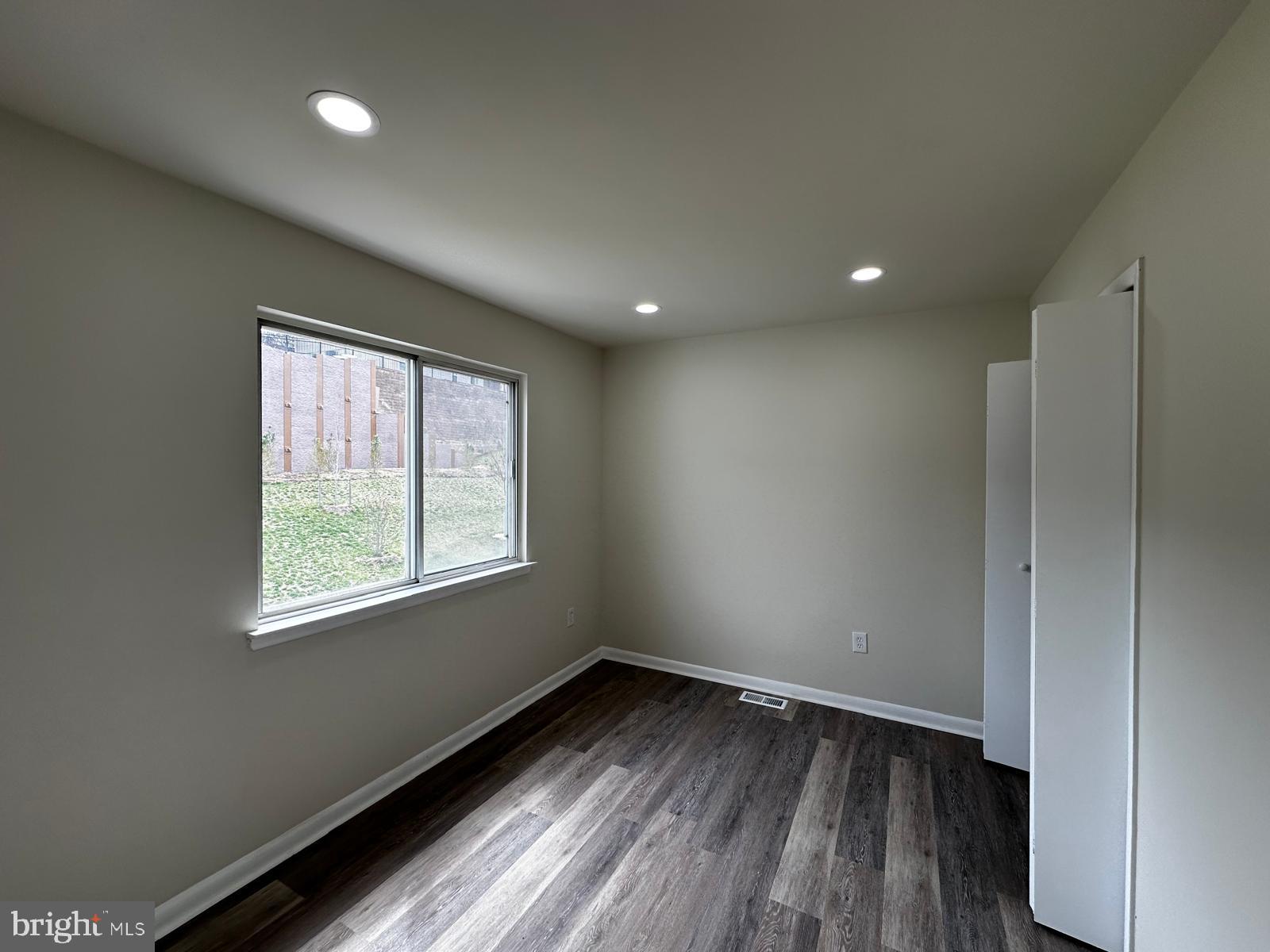 12800 Asbury Drive Fort Washington, MD 20744 - Photo 33 of 53 an empty room with wooden floor and windows