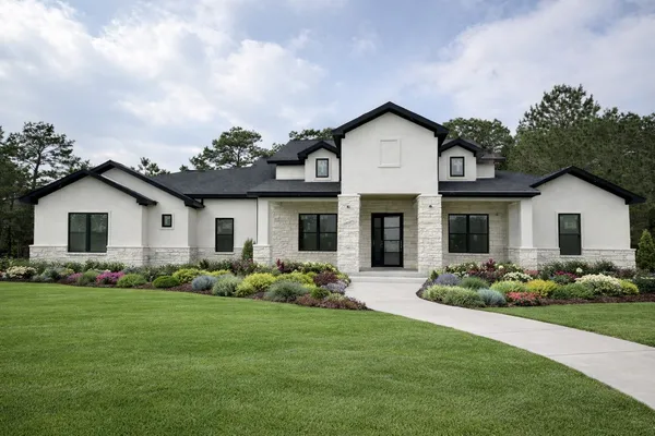 a front view of a house with garden