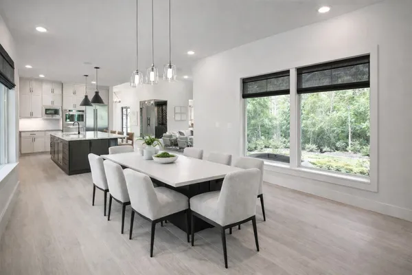 a view of a dining room with furniture window and outside view