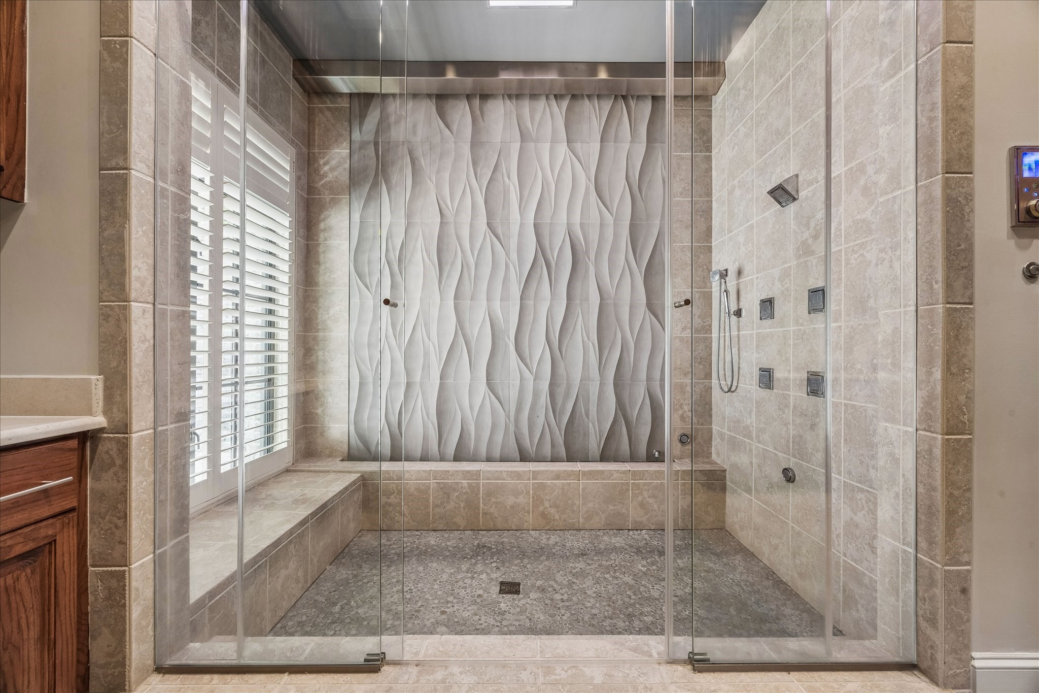 802 Country Lane Houston, TX 77024 - Photo 19 of 34 a bathroom with a shower and a bathtub