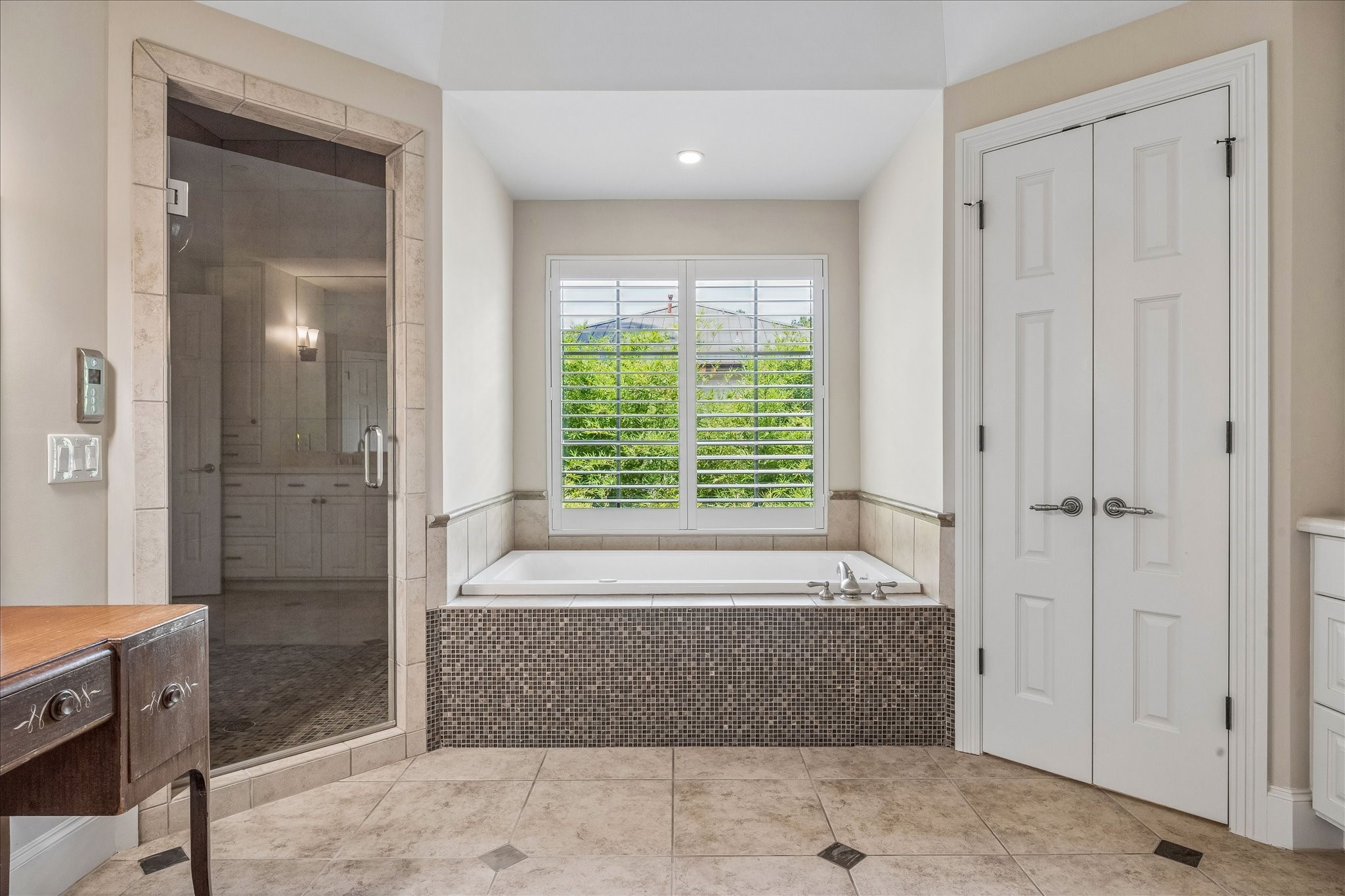 802 Country Lane Houston, TX 77024 - Photo 24 of 34 a spacious bathroom with a tub shower and sink