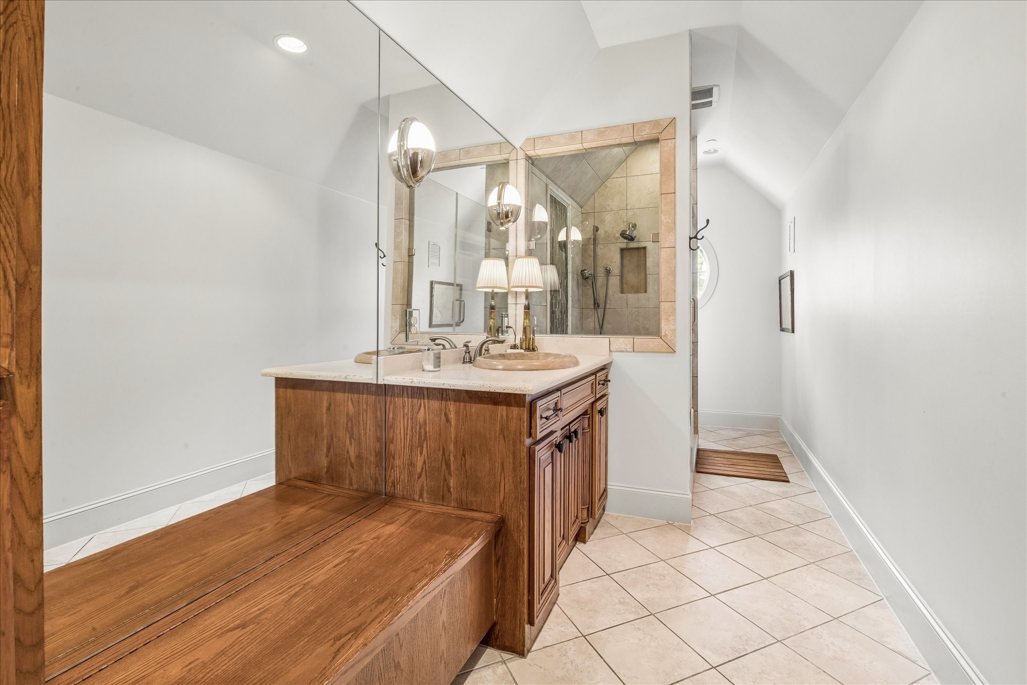 802 Country Lane Houston, TX 77024 - Photo 26 of 34 a bathroom with a sink a mirror and a shower