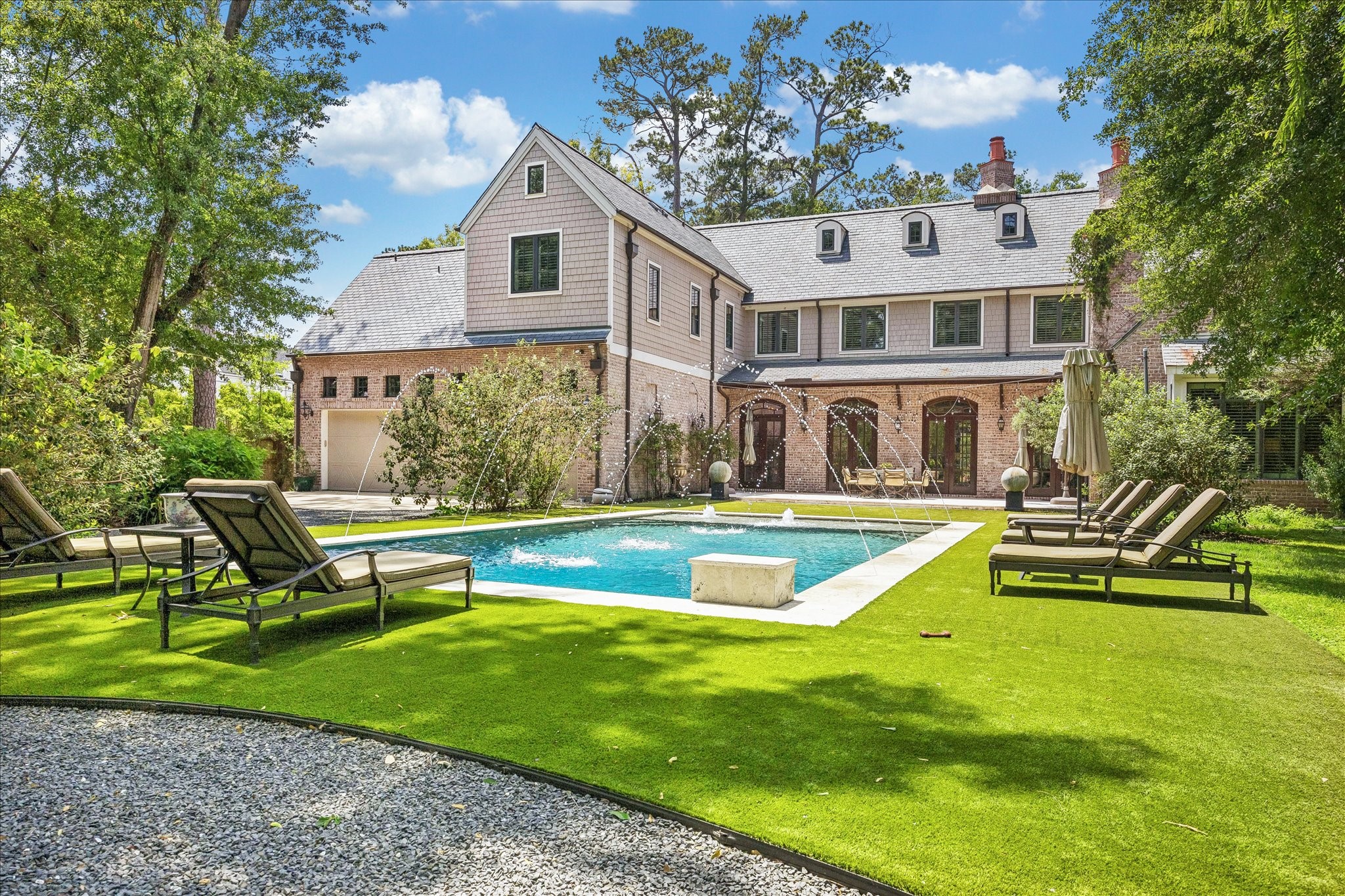 802 Country Lane Houston, TX 77024 - Photo 29 of 34 a view of a house with a swimming pool