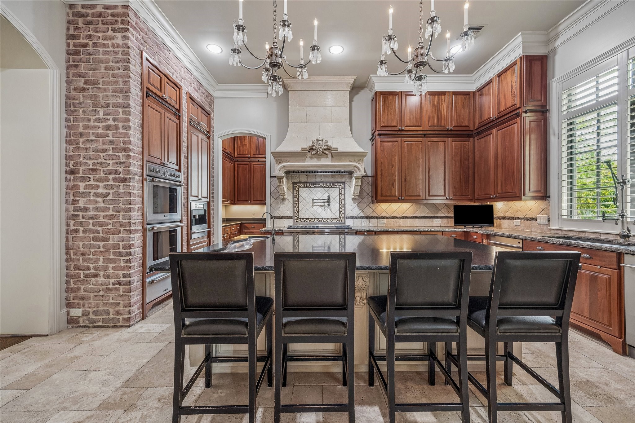 802 Country Lane Houston, TX 77024 - Photo 6 of 34 a view of a dining room with furniture a chandelier and wooden floor