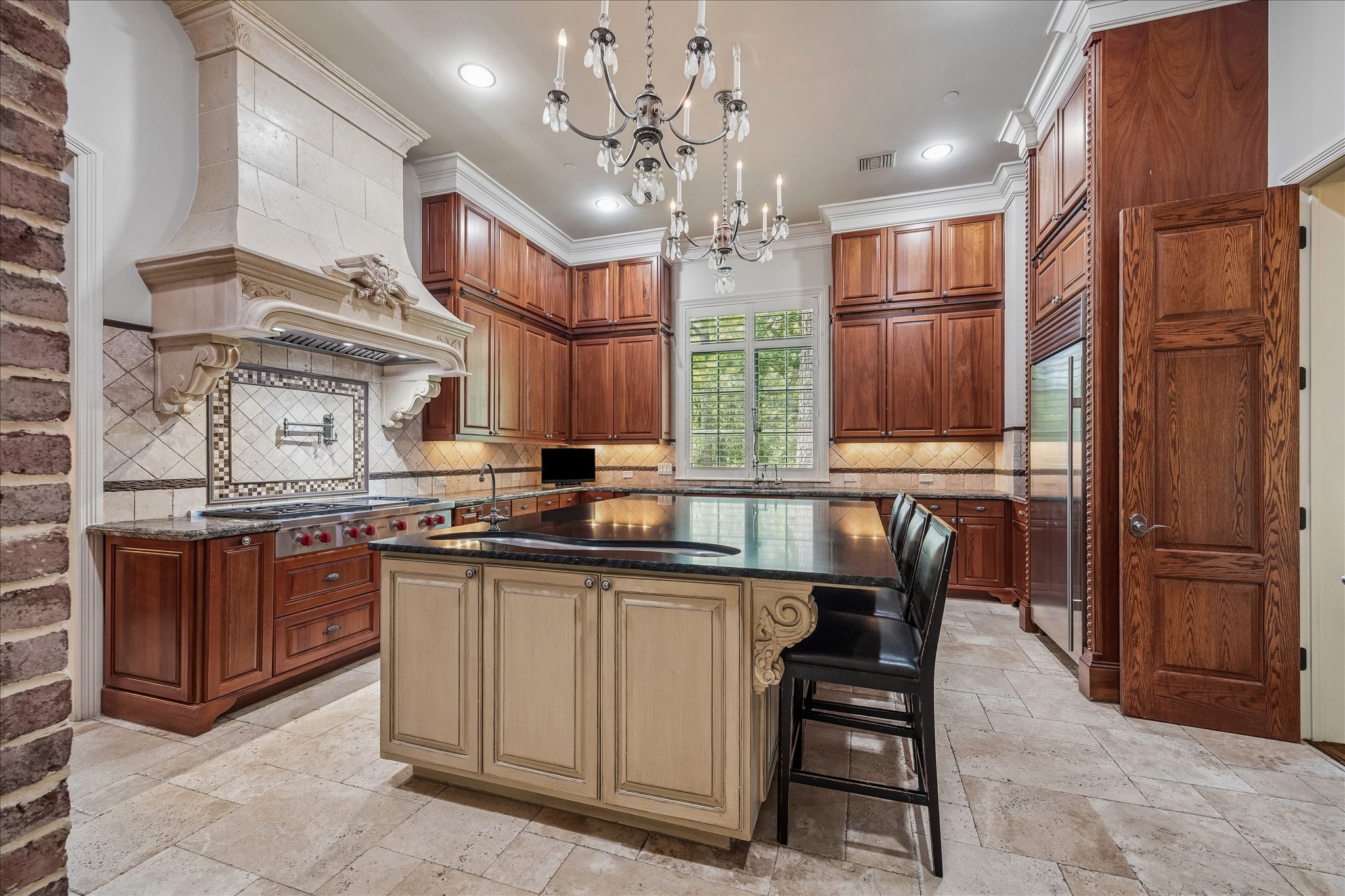 802 Country Lane Houston, TX 77024 - Photo 8 of 34 a kitchen with stainless steel appliances granite countertop a sink a stove and a refrigerator