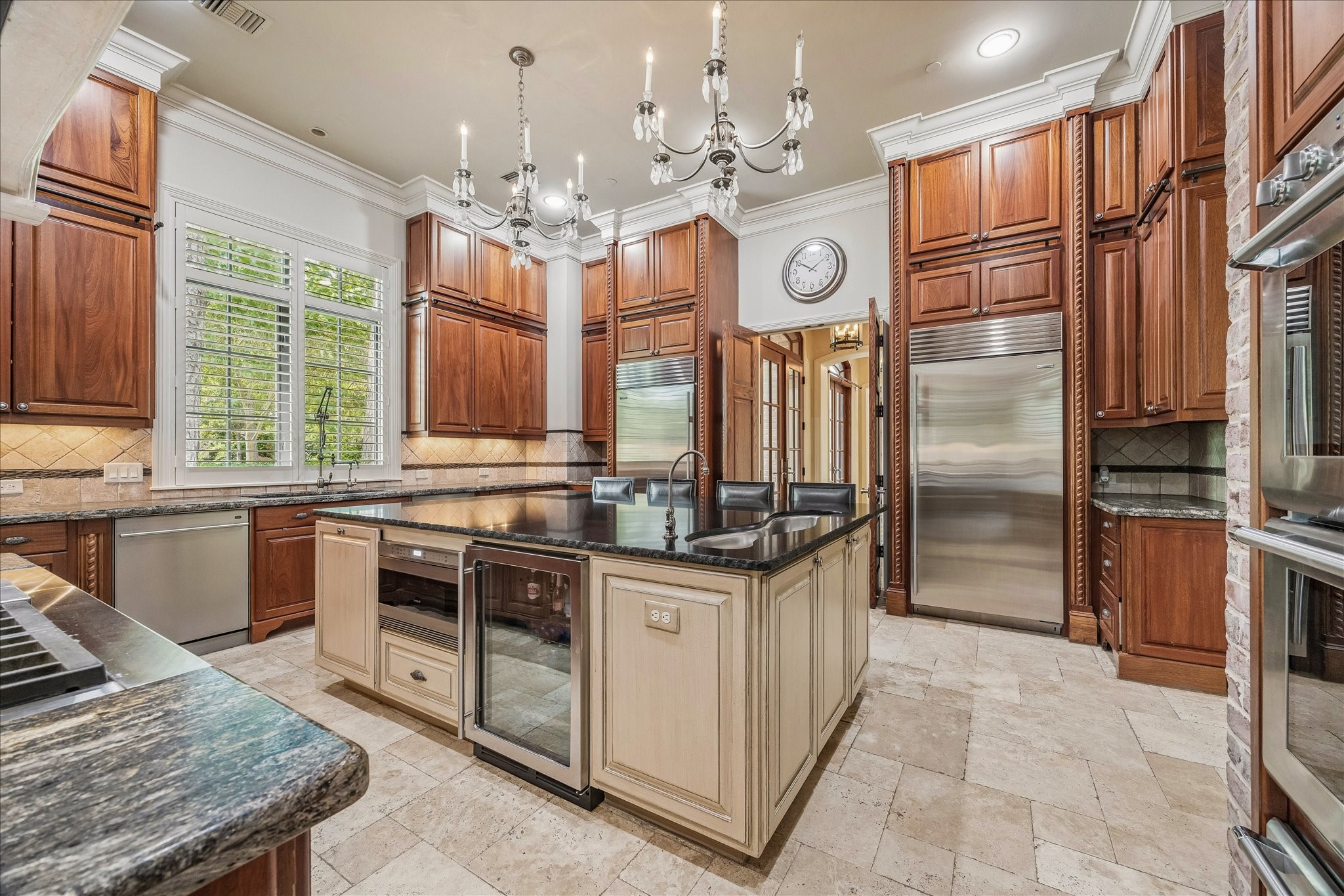 802 Country Lane Houston, TX 77024 - Photo 9 of 34 a kitchen with stainless steel appliances granite countertop a stove and a refrigerator