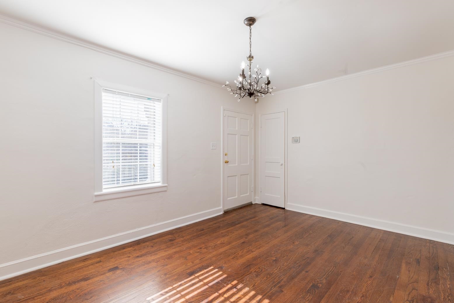 37 North Fenwick Road Memphis, TN 38111 - Photo 8 of 31 an empty room with wooden floor and ceiling fan