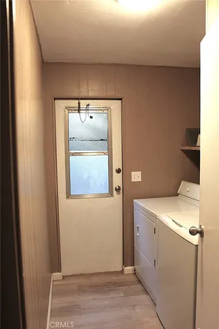 a bathroom with a toilet a sink and shower