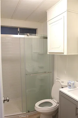 a bathroom with a bathtub and a toilet