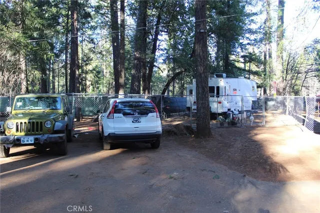 a view of street with parked cars