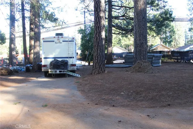 a view of a street with a parked cars