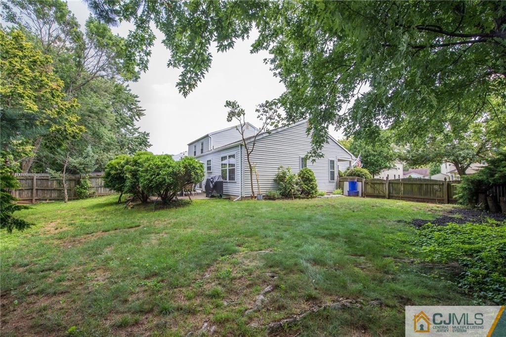 8 Woodbury Road Edison, NJ 08820 - Photo 17 of 18 a house view with a garden space