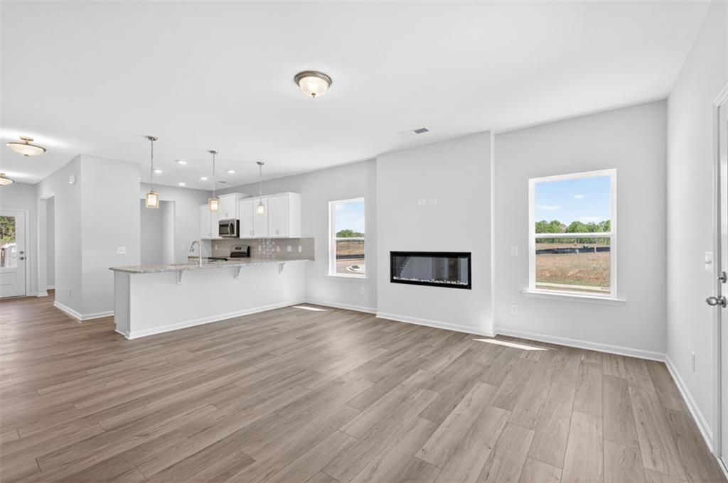 723 Sinclair Lane Temple, GA 30179 - Photo 15 of 40 a view of kitchen and hall with wooden floor