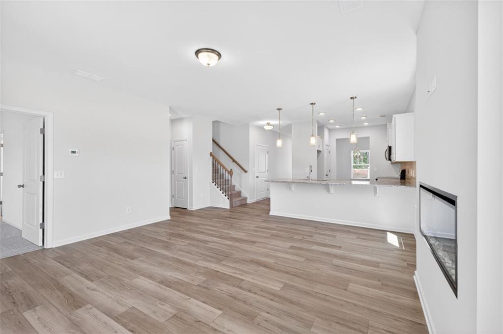 723 Sinclair Lane Temple, GA 30179 - Photo 16 of 40 a view of empty room with wooden floor