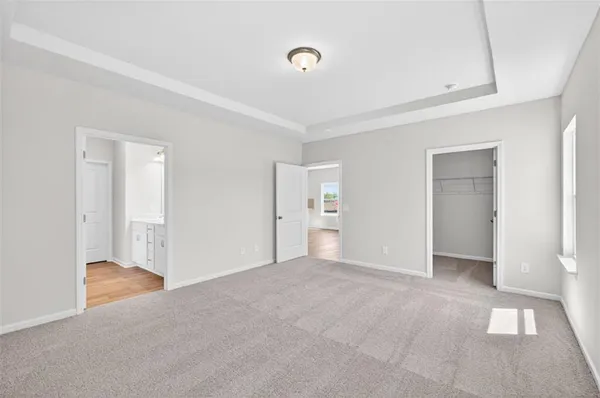 a bathroom with a double vanity sink and mirror with shower