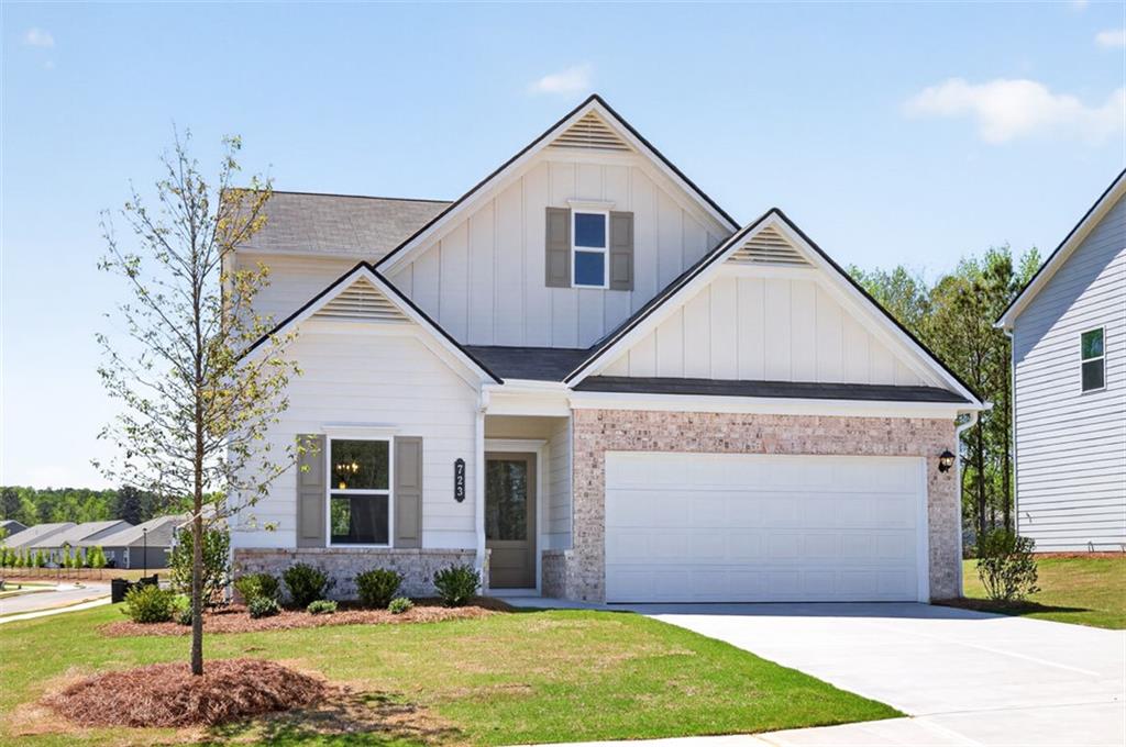 723 Sinclair Lane Temple, GA 30179 - Photo 2 of 40 a front view of a house with a yard and garage