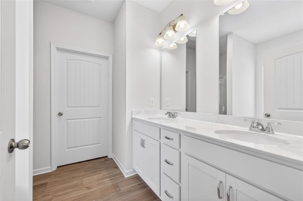 723 Sinclair Lane Temple, GA 30179 - Photo 22 of 40 a bathroom with double vanity sinks and a mirror