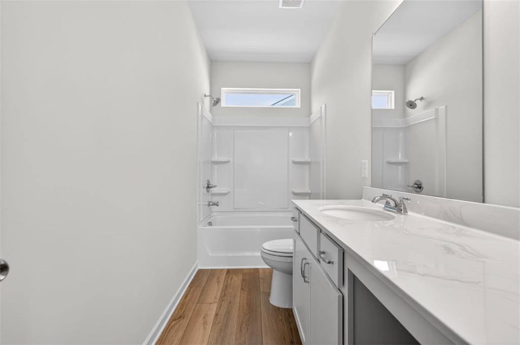 723 Sinclair Lane Temple, GA 30179 - Photo 38 of 40 a bathroom with a sink a toilet and shower