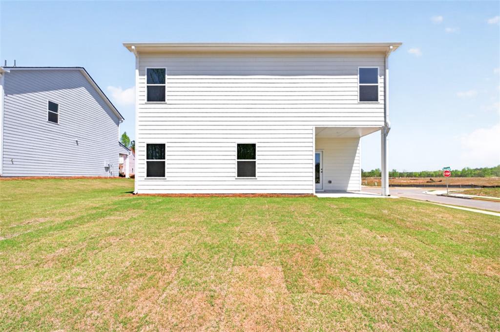 723 Sinclair Lane Temple, GA 30179 - Photo 39 of 40 a view of a house with a backyard